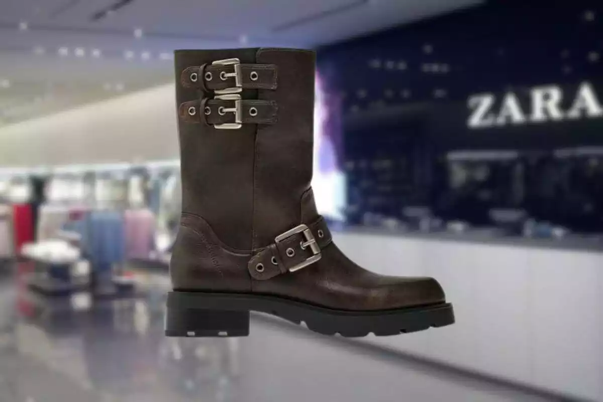 Foto en primer término de una bota Zara con tienda desenfocada de fondo Foto en primer término de una bota Zara con tienda desenfocada de fondo